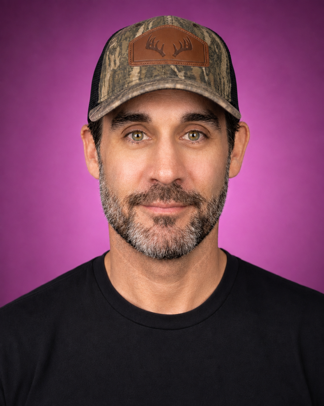 Craig from CraigDoesAI wearing a camouflage cap and black T-shirt